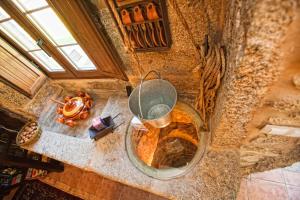 an overhead view of a kitchen with a large pot at Casa Castiñeira in Muxia