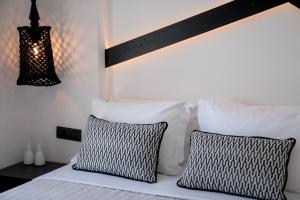 Ένα ή περισσότερα κρεβάτια σε δωμάτιο στο Divelia Hotel