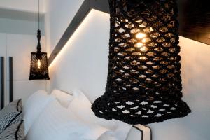 Ένα ή περισσότερα κρεβάτια σε δωμάτιο στο Divelia Hotel