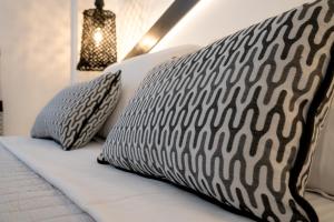 Ένα ή περισσότερα κρεβάτια σε δωμάτιο στο Divelia Hotel
