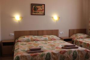Postel nebo postele na pokoji v ubytování Hotel Radik