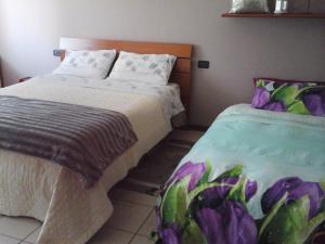 A bed or beds in a room at Appartamento del Parco