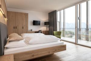 Posteľ alebo postele v izbe v ubytovaní Hotel Lichtenstern