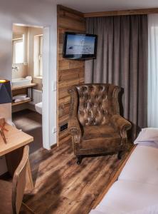 Ein Bett oder Betten in einem Zimmer der Unterkunft Berggasthof Edelweiss