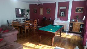 a living room with a pool table in it at Vingt Grand Rue in Champagne-Mouton +27 photos