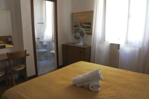 Letto o letti in una camera di Hotel Loreto