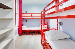 a bunk bed room with two bunk beds at Astor Kensington Hostel in London