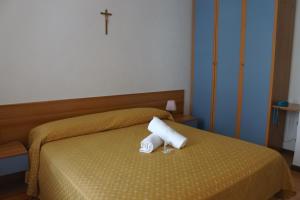Letto o letti in una camera di Hotel Loreto