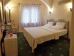Postel nebo postele na pokoji v ubytování A&B Home Hotel
