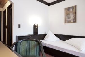 Postel nebo postele na pokoji v ubytování Hotel Neue Burg