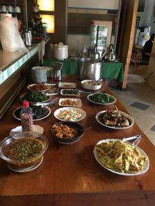 a table with a bunch of different types of food at 衿日林民宿丨童玩節對面丨可12-30人包棟烤肉戲水池 in Dongshan