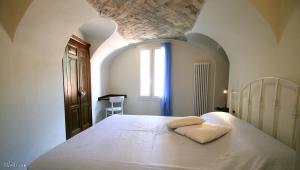 A bed or beds in a room at U Campanin