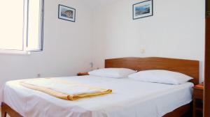 Postel nebo postele na pokoji v ubytování Beach front apartments Balica Rat