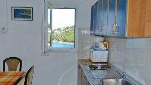 Kuchyň nebo kuchyňský kout v ubytování Beach front apartments Balica Rat