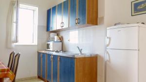 Kuchyň nebo kuchyňský kout v ubytování Beach front apartments Balica Rat