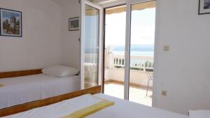 Postel nebo postele na pokoji v ubytování Beach front apartments Balica Rat