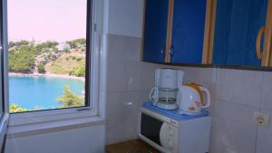 Kuchyň nebo kuchyňský kout v ubytování Beach front apartments Balica Rat