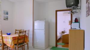 Kuchyň nebo kuchyňský kout v ubytování Beach front apartments Balica Rat