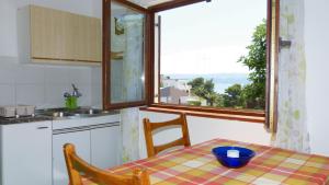 Kuchyň nebo kuchyňský kout v ubytování Beach front apartments Balica Rat