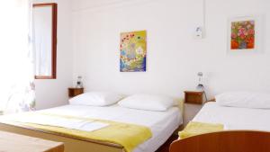 Postel nebo postele na pokoji v ubytování Beach front apartments Balica Rat