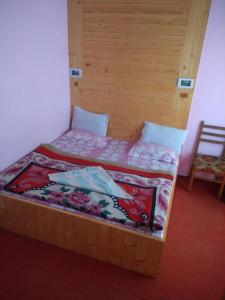 Postel nebo postele na pokoji v ubytování Hotel Jannat