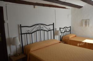 A bed or beds in a room at Mas de Bruquet