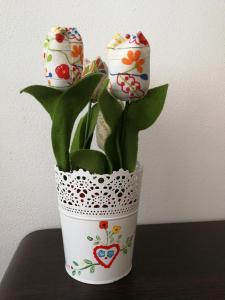 a white vase with eggs on top of a plant at Casa da Travessa in Ponte de Lima +51 photos