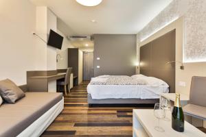 Postel nebo postele na pokoji v ubytování Hotel Gardesana