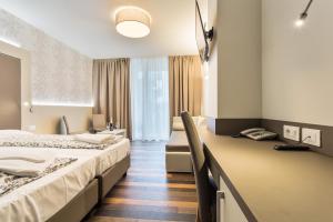 Postel nebo postele na pokoji v ubytování Hotel Gardesana