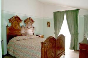 Tempat tidur dalam kamar di Albergo Olivo