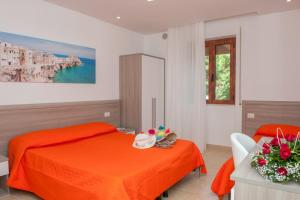 Rúm í herbergi á Albergo San Giorgio