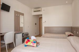 Rúm í herbergi á Albergo San Giorgio