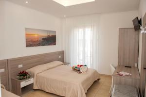 Rúm í herbergi á Albergo San Giorgio
