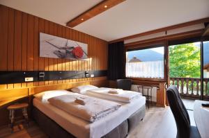 Katil atau katil-katil dalam bilik di Pension & Apartments Weissbriach