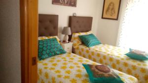 Postel nebo postele na pokoji v ubytování Habitaciones privadas Alicante centro