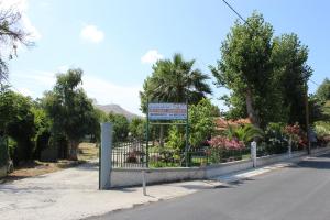 a sign on the side of a road at Studio Aspa in Skala Eresou