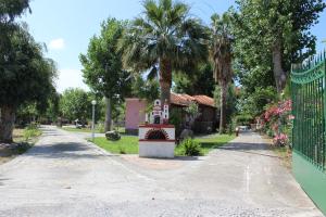 a park with a statue in the middle of a sidewalk at Studio Aspa in Skala Eresou