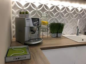a kitchen with a coffee maker on a counter at Family & Business Elegant Apartments ul Warszawska - 2 Bedroom, Balcony, Parking in Kielce