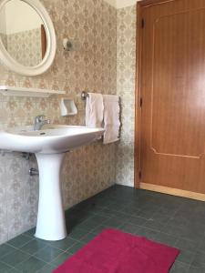 a bathroom with a white sink and a mirror at Residence Europa in Alba Adriatica