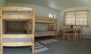 a bunk bed with two bunk beds in a room at Oddestemmen Camping in Evje