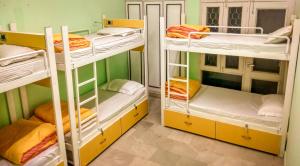 a group of bunk beds in a room at The Desire Hostel in New Delhi