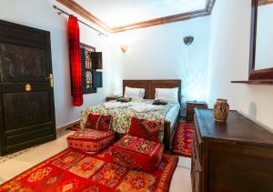 Säng eller sängar i ett rum på Riad Marwa Marrakech
