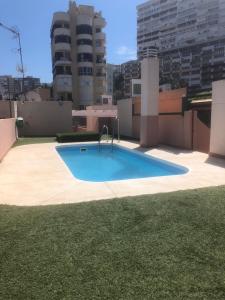 a swimming pool on the roof of a building at Luxury Playamar Beach in Torremolinos