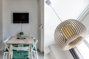 Televízia a/alebo spoločenská miestnosť v ubytovaní Apartment Link BCN Sants