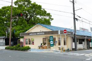 a store on the corner of a street with a traffic light at ABC Guest House 2F in Izumi-Sano