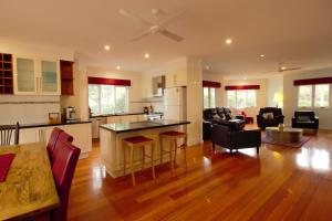 a kitchen and living room with a table and chairs at Lithgow Falls Marysville in Marysville