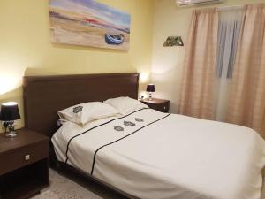 Postel nebo postele na pokoji v ubytování Merhba APT 3 + 34 fotografií