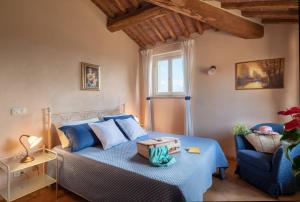 Ένα ή περισσότερα κρεβάτια σε δωμάτιο στο Villa il Borghetto