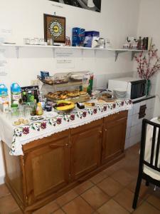 a kitchen with a counter with food on it at Palazzo Della Marra in Ravello