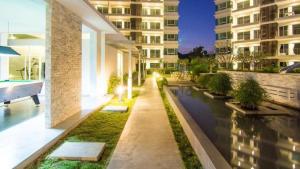 a building with a canal in front of a building at The Sea B36 in Sam Roi Yot